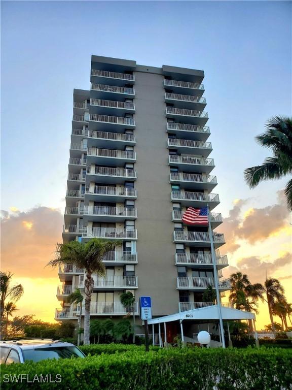 view of outdoor building at dusk