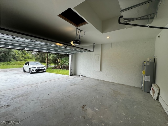 garage with electric water heater and a garage door opener