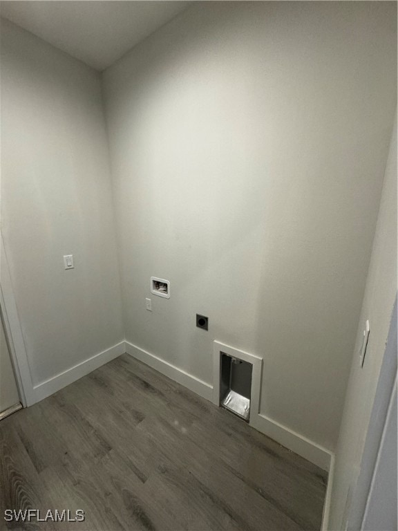 laundry room featuring hookup for an electric dryer, dark hardwood / wood-style flooring, and washer hookup