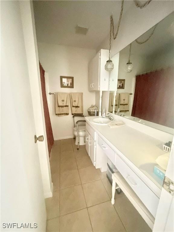 3871 27th Ave SW, Naples, FL 34117 - full bathroom featuring baseboards, double vanity, tile patterned floors, and a sink