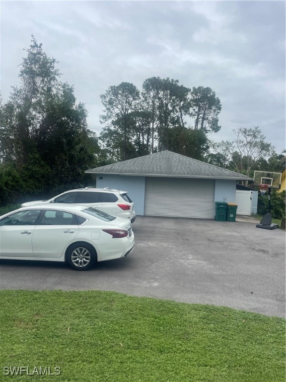 garage featuring a yard