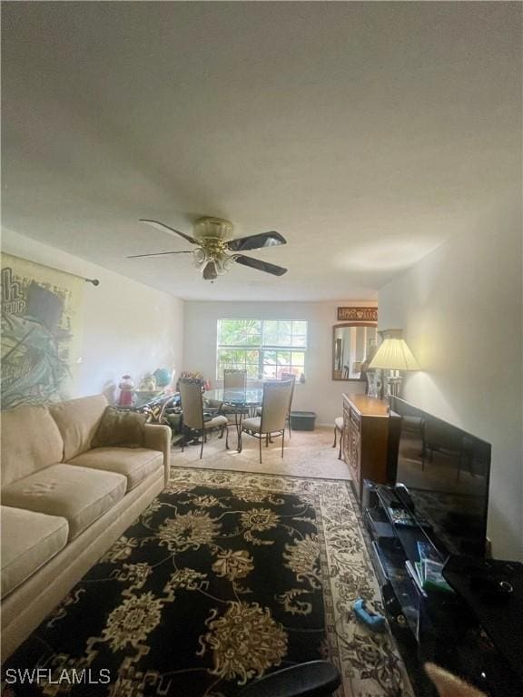 3871 27th Ave SW, Naples, FL 34117 - living area featuring ceiling fan and light carpet