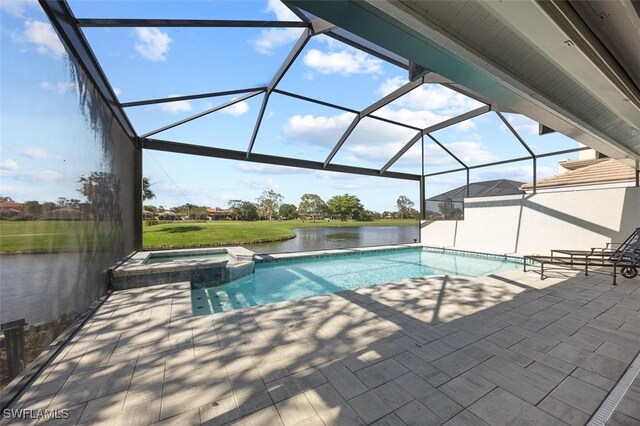 view of swimming pool featuring glass enclosure, a water view, an in ground hot tub, and a patio