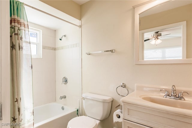 full bathroom with vanity, toilet, shower / bath combo, and ceiling fan