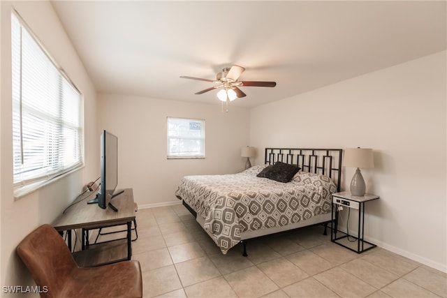 bedroom with light tile patterned floors and ceiling fan