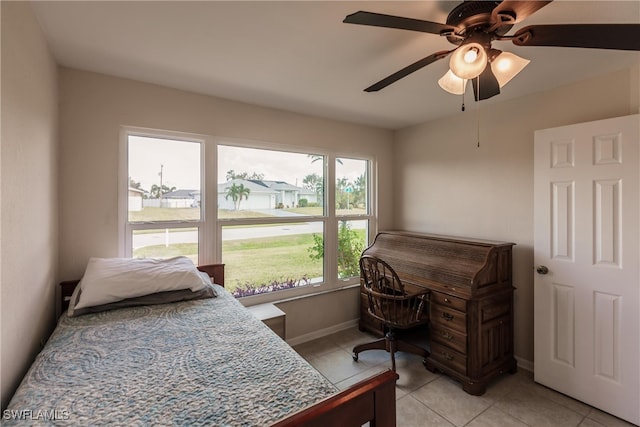 bedroom featuring light tile patterned floors and ceiling fan