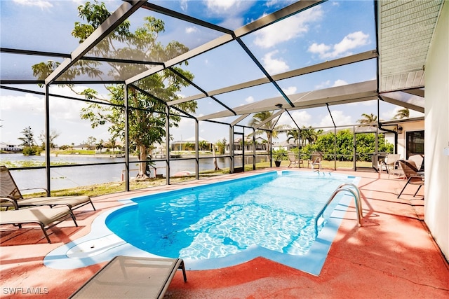 view of swimming pool featuring a patio, a water view, and glass enclosure