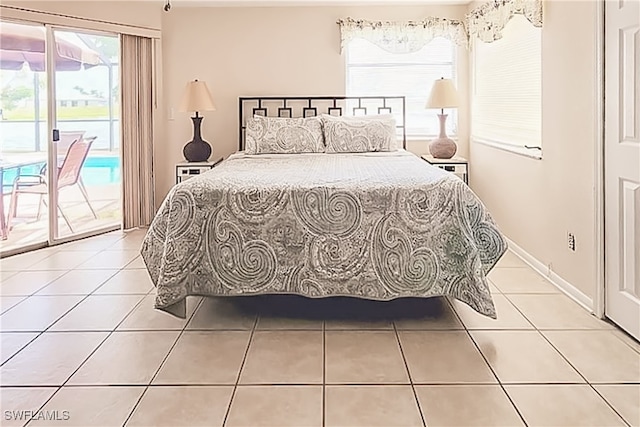 tiled bedroom featuring access to outside