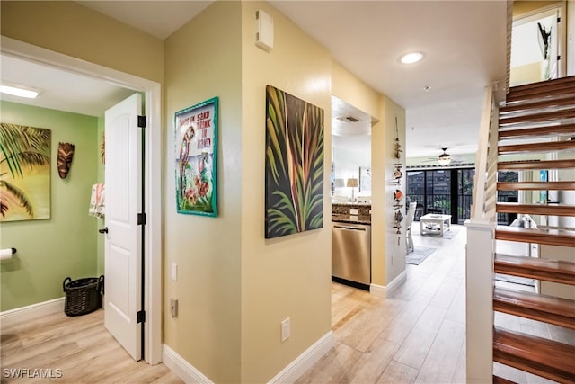 corridor featuring light hardwood / wood-style floors