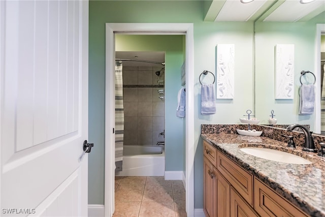 bathroom featuring vanity, shower / tub combo with curtain, and tile patterned flooring