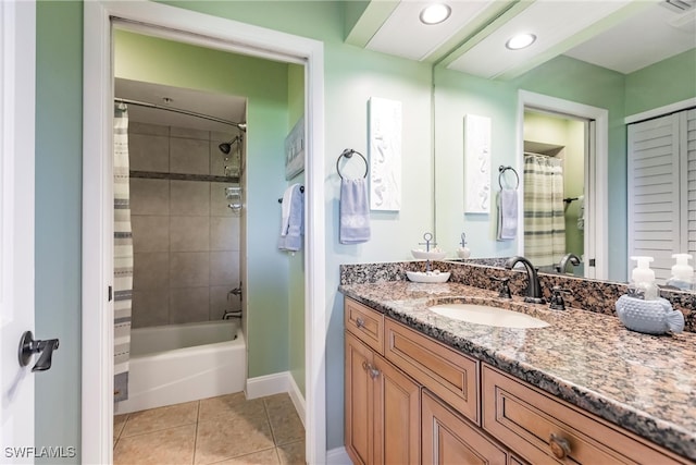 bathroom featuring vanity, shower / bathtub combination with curtain, and tile patterned flooring