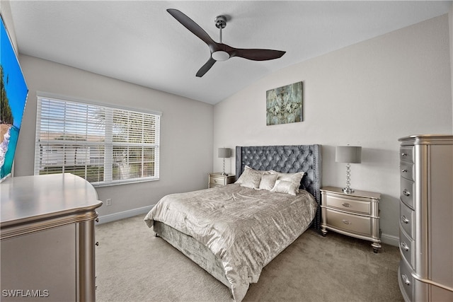 carpeted bedroom featuring ceiling fan and lofted ceiling