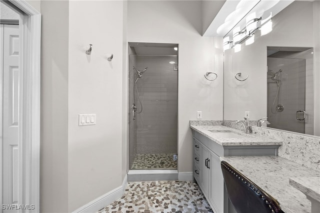 bathroom featuring vanity, tile patterned floors, and a shower with shower door