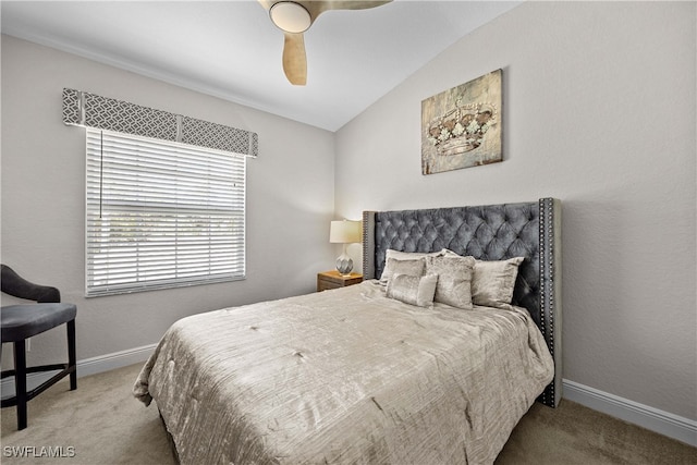 carpeted bedroom featuring vaulted ceiling and ceiling fan