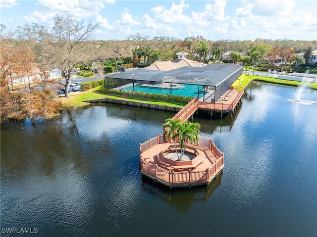 dock area featuring a water view and a pool with hot tub