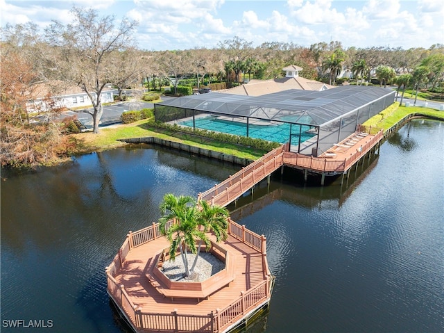 dock area with a water view and glass enclosure