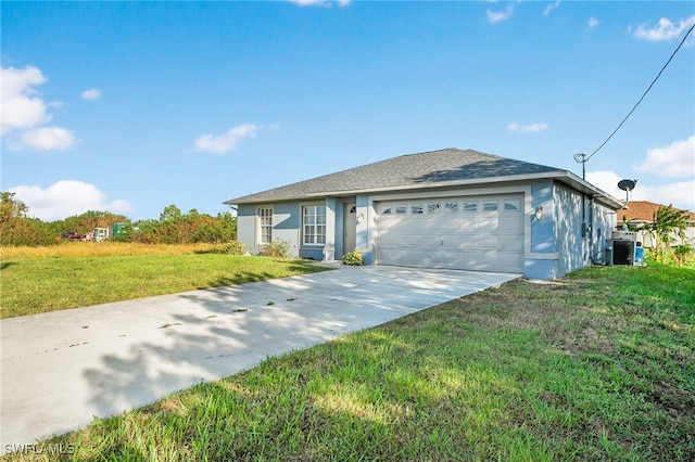 ranch-style house featuring cooling unit, a garage, and a front lawn