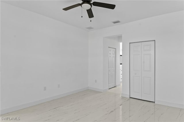 unfurnished bedroom featuring ceiling fan