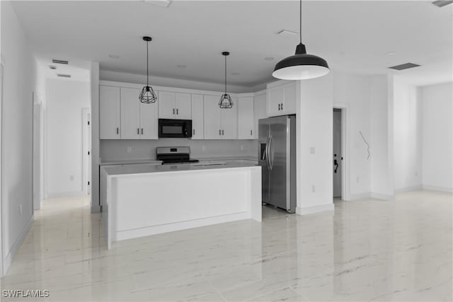 kitchen featuring stainless steel appliances, white cabinets, decorative light fixtures, and a center island