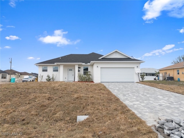 ranch-style house with a front lawn and a garage