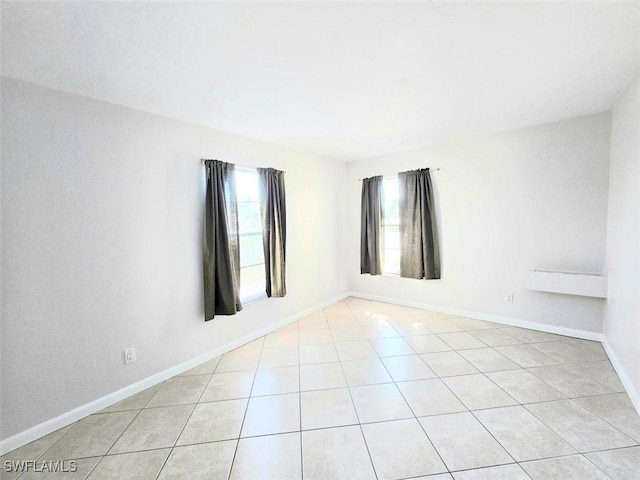 empty room featuring light tile patterned flooring