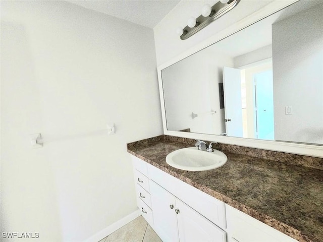 bathroom with tile patterned flooring and vanity