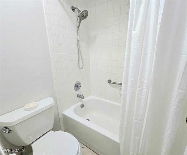 bathroom with toilet and shower / bath combo with shower curtain