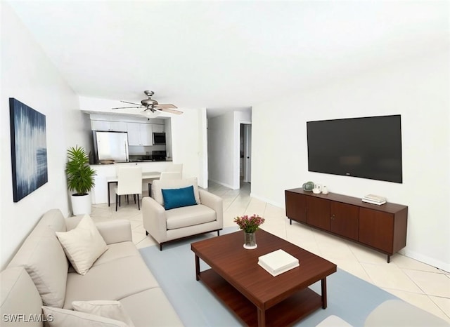 tiled living room with ceiling fan