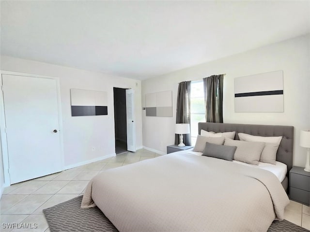 bedroom featuring light tile patterned flooring