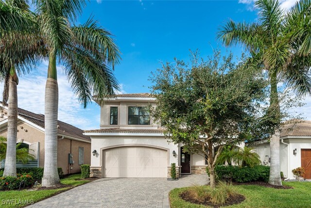 mediterranean / spanish-style home featuring a garage