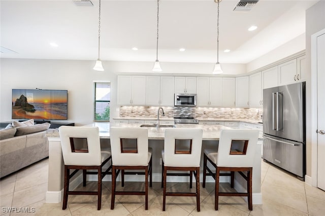 kitchen with sink, white cabinetry, and stainless steel appliances