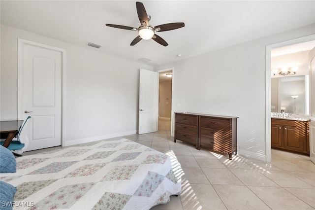 tiled bedroom featuring connected bathroom and ceiling fan