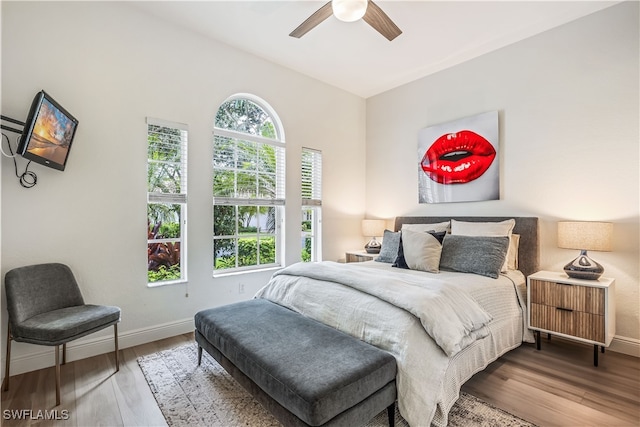 bedroom with ceiling fan and hardwood / wood-style floors