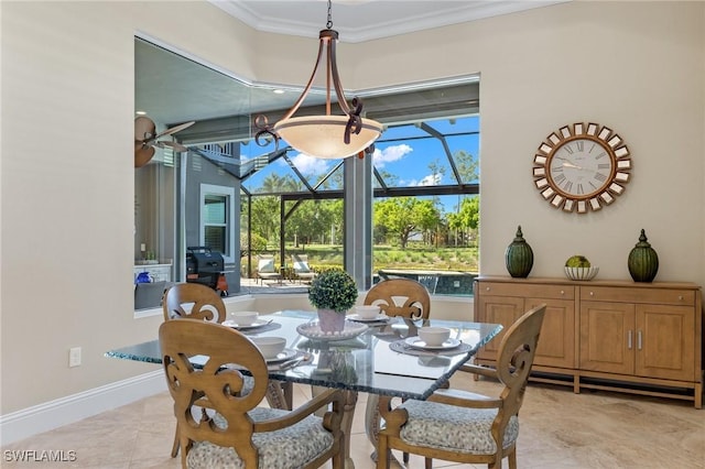 dining space with light tile patterned floors and crown molding