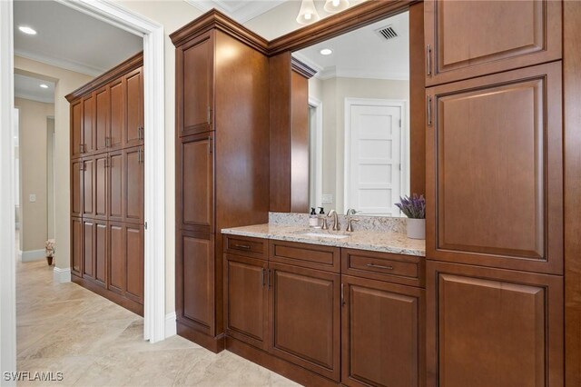 bathroom featuring vanity and crown molding