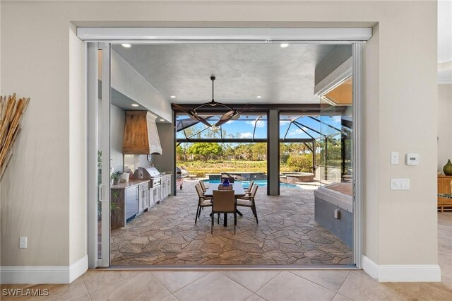 tiled dining area with floor to ceiling windows