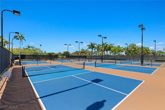 view of tennis court featuring basketball court