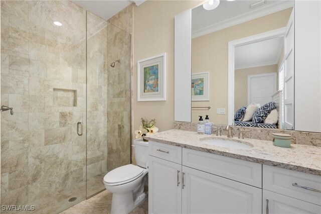 bathroom with crown molding, vanity, an enclosed shower, and toilet