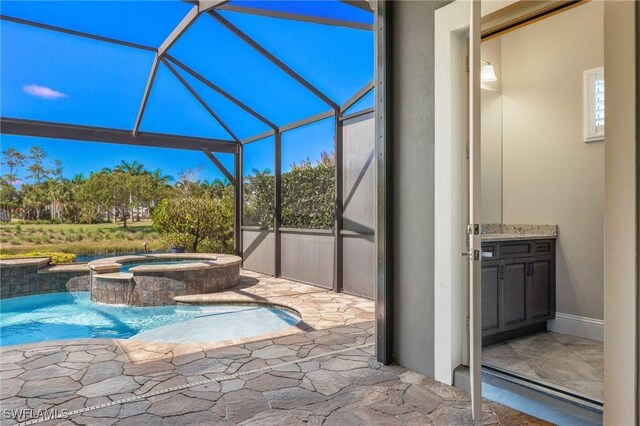 view of patio with glass enclosure and a pool with hot tub