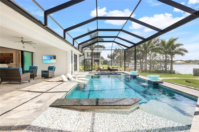 view of swimming pool featuring ceiling fan, glass enclosure, a patio, an in ground hot tub, and a water view