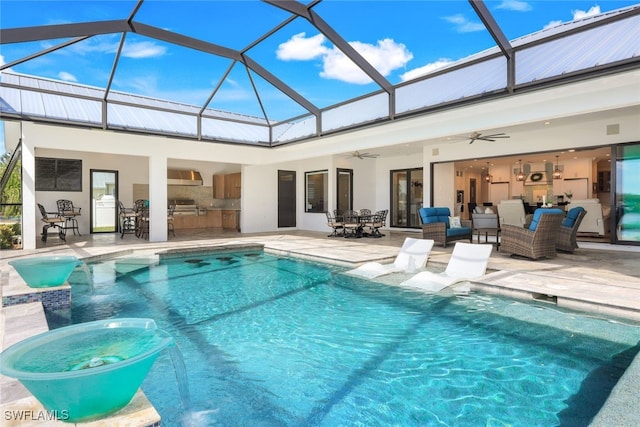 view of swimming pool with an outdoor hangout area, pool water feature, a patio area, glass enclosure, and ceiling fan