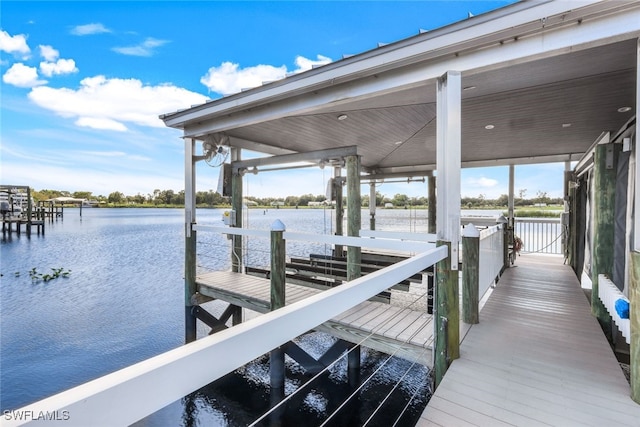 dock with a water view and boat lift