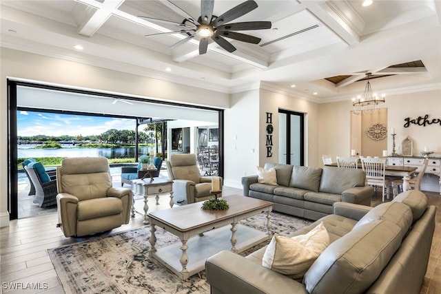 living room featuring beam ceiling, ceiling fan, light wood-type flooring, ornamental molding, and coffered ceiling