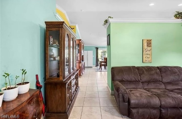 tiled living room featuring crown molding