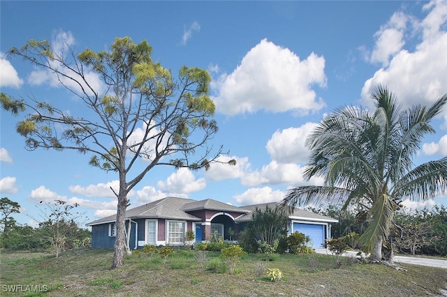 single story home featuring a garage