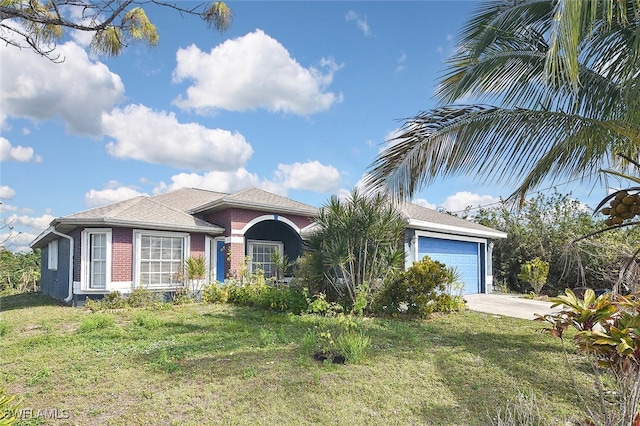 view of front of home featuring a garage and a front lawn