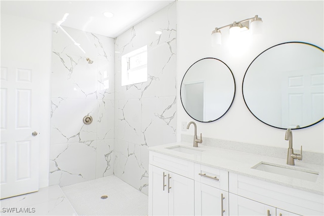 bathroom featuring vanity and a tile shower