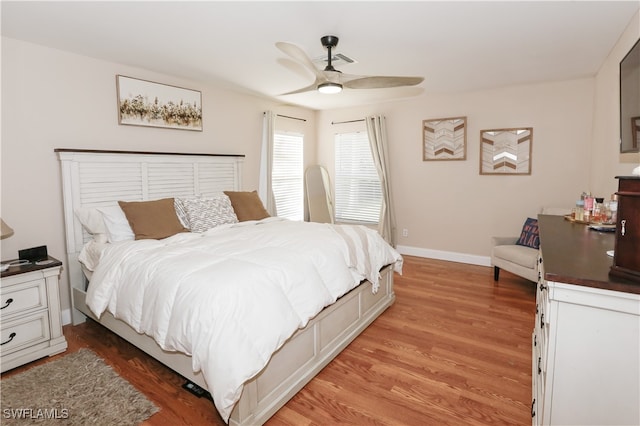 bedroom with ceiling fan and light wood-type flooring