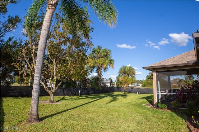 view of yard with a sunroom