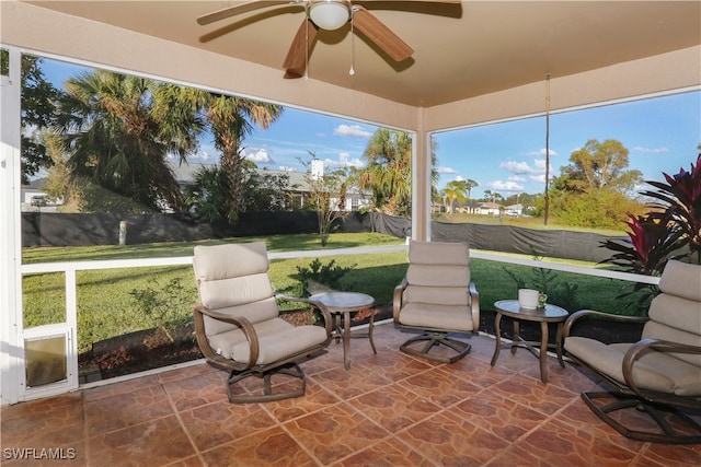 sunroom / solarium with ceiling fan